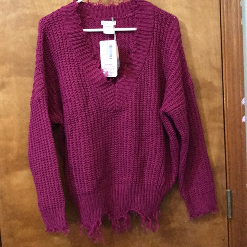 Distressed sweater